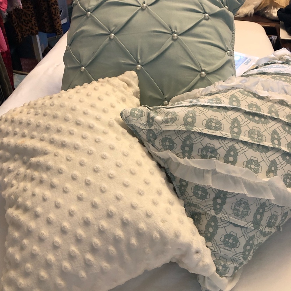 White and Green Accent Pillows with Textured Patterns